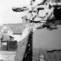 30-681 demolition of the cruck houses in Bull Head Street. in the background you can see Quaker Cottage. An old farmhouse.