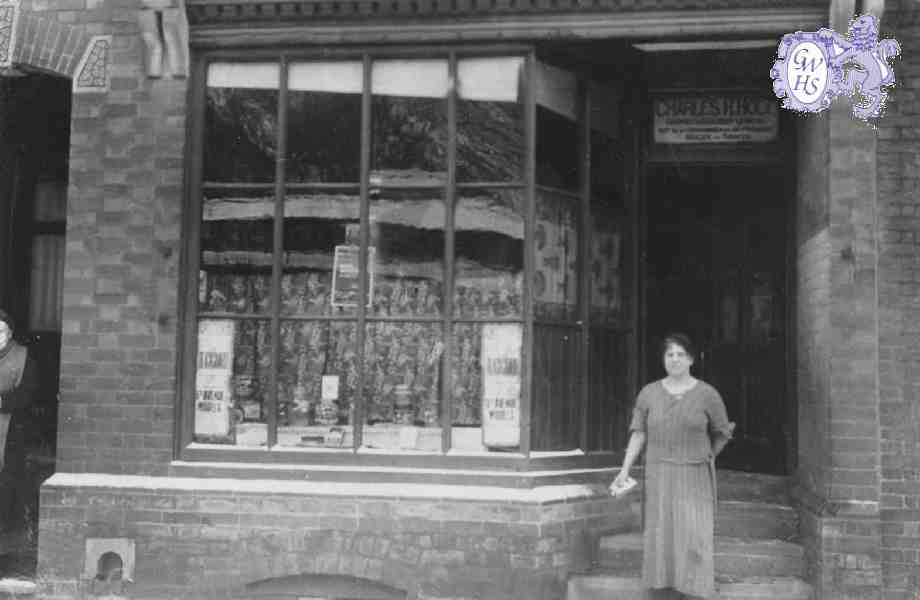 29-113a Shop of Charles H Hold 18 Bushloe End Wigston Magna with Emma Holt nee Bates in shop doorway c 1940