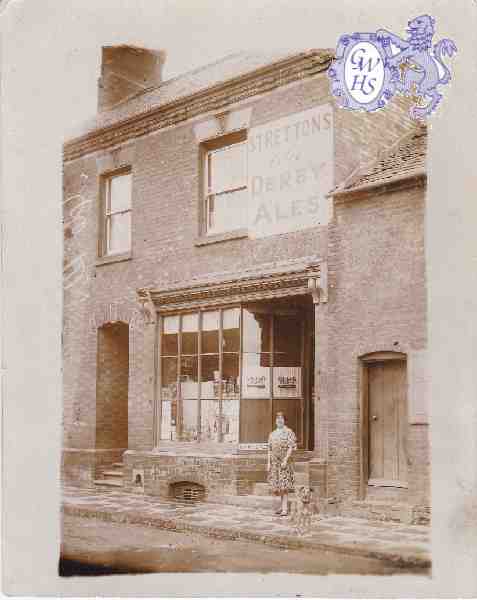 29-642 18 Bushloe End Wigston Magna Emma Bates nee Holt outside her shop c 1940