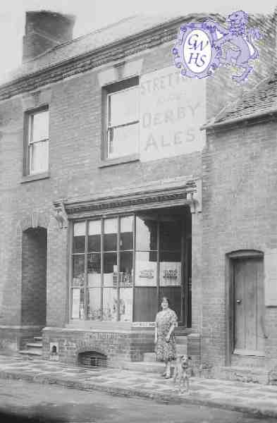 29-642a 18 Bushloe End Wigston Magna Emma Bates nee Holt outside her shop c 1940