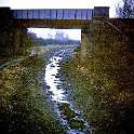 31-317 Canal empty in 1976 and railway bridge near Crow Mills