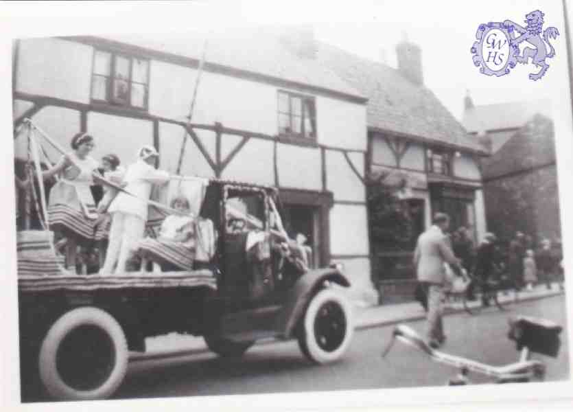9-57 Carnival with Quaker House Bull Head Street Wigston Magna in the backgoround
