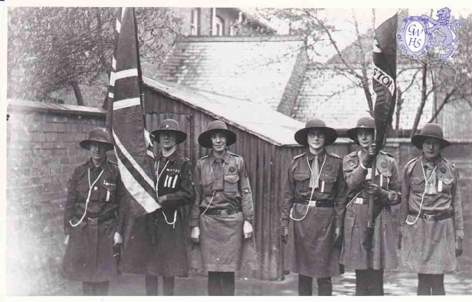 9-93 1st Wigston Guides holding flag 2nd May 1930
