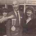 22-583 Mrs Edna Childs presents Post Office staff a medal 1990
