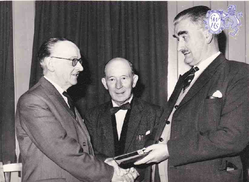 30-461 George Broughton centre at a presentation to a Co-operative member of staff