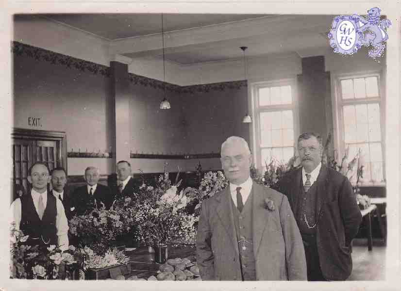 30-466 George Broughton far left taken at flower show in the Long Street building board room