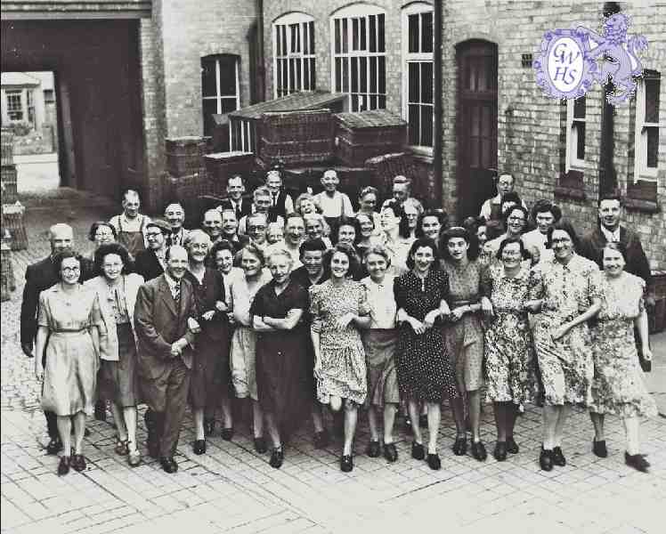 30-580 Co-Operative Hosiers Paddock Street Wigston Magna Staff inside the entrance yard.