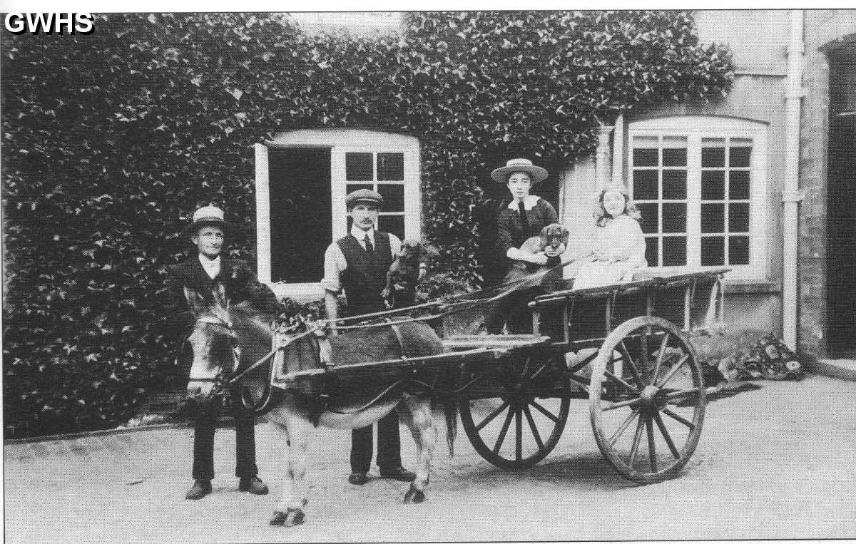 22-138 The Rolleston Family at Glen Parva Grange 1905 Clarice Clover and Dorothy Wright in the cart with John Wright holding the donkey