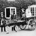 7-104 The Rolleston Family at Glen Parva Grange 1905 Clarice Clover and Dorothy Wright in the cart with John Wright holding the donkey