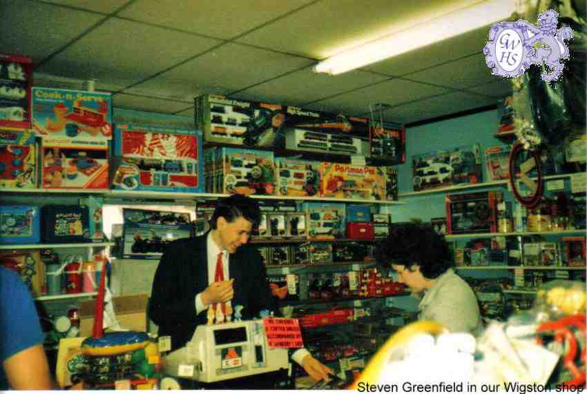 32-115 Steven Greenfield serving in Fairplay Toy shop Leicester Road Wigston Magna 1990
