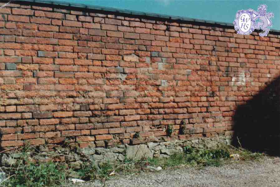 8-189 Long Gone brick wall on stone plinth in Long Street Wigston Magna