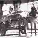 6-49 Milk delivery outside Forryan Corner - See adverts on wall