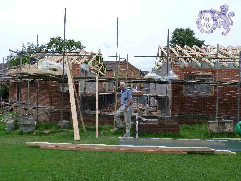 22-006 Duncan Lucas outside his new bungalow on Newton Lane - under construction in summer 2012
