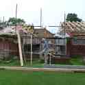 22-006 Duncan Lucas outside his new bungalow on Newton Lane - under construction in summer 2012
