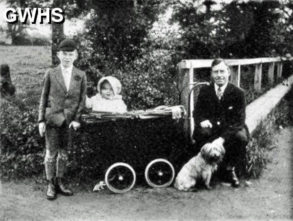35-328 raised footpath at Crow Mills. L to R Eric Faulkner, Alma Faulkner, Albert Faulkner taken about 1931.
