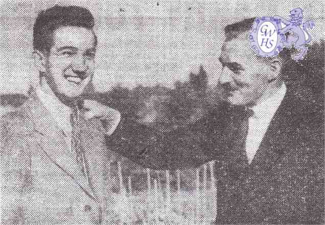 26-106 Trevor Harris being congratulated by Councilor Curtis Weston July 1949