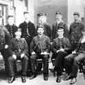 26-465  early 1900's Midland Railway staff in a classic group photo on the platform at Wigston South station