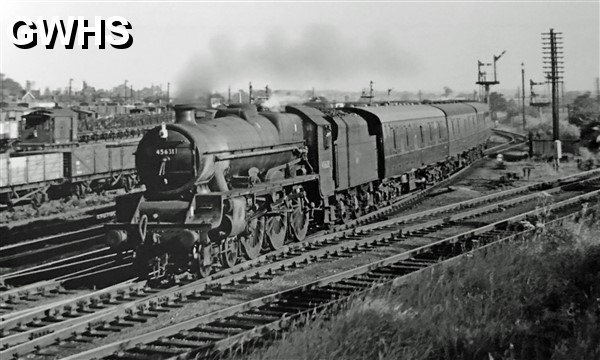 39-088 21A Saltley engine 4-6-0 No 45631 Tanganyika passes through Wigston North Junction 1963