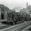 39-107 Br 2-10-0 No 92164 passing under Spion Kop Leicester bound 1962 with Wigston Magna station in the background