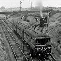 39-158 Steam hauled goods being held on the South Curce for a DMU entering Glen Parva station 1959