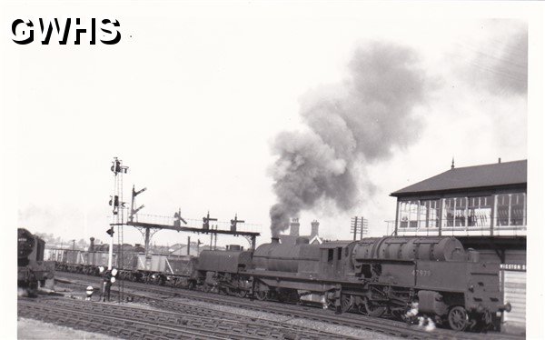 7-133 South bound train passing Wigston South Junction Signal Box