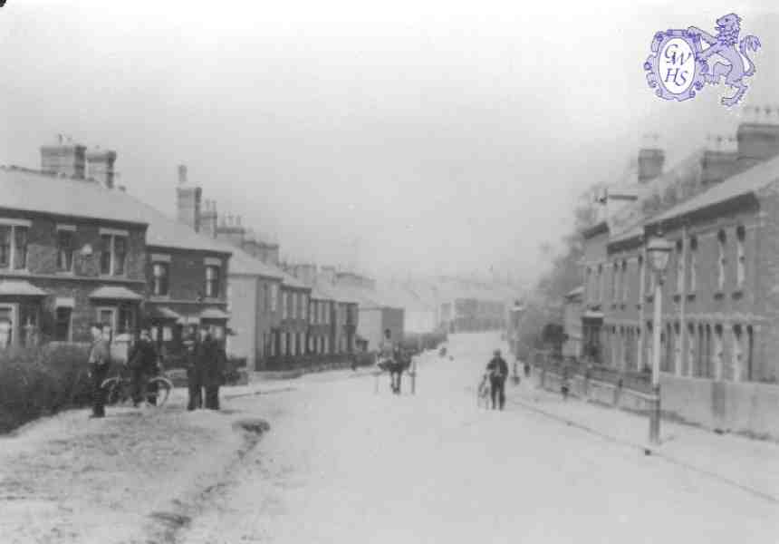 23-013 Welford Road  Wigston Magna looking north - men on left watching football 1900's