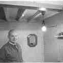 22-225 Hubert Hall in back room of his cycle, wireless and TV shop in Long Street  Wigston Magna